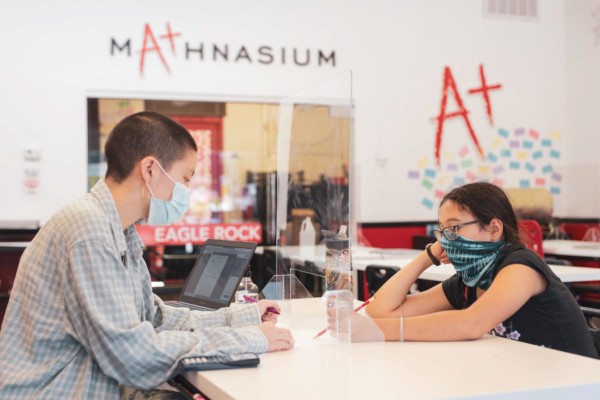 Mathnasium tutor helping a math student with their curriculum